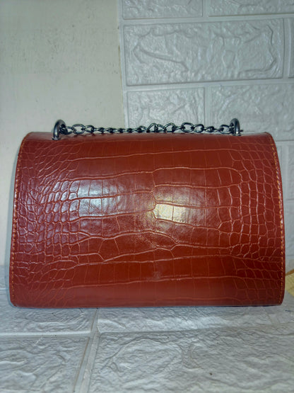 Marina Galanti small croc-embossed leather crossbody bag.