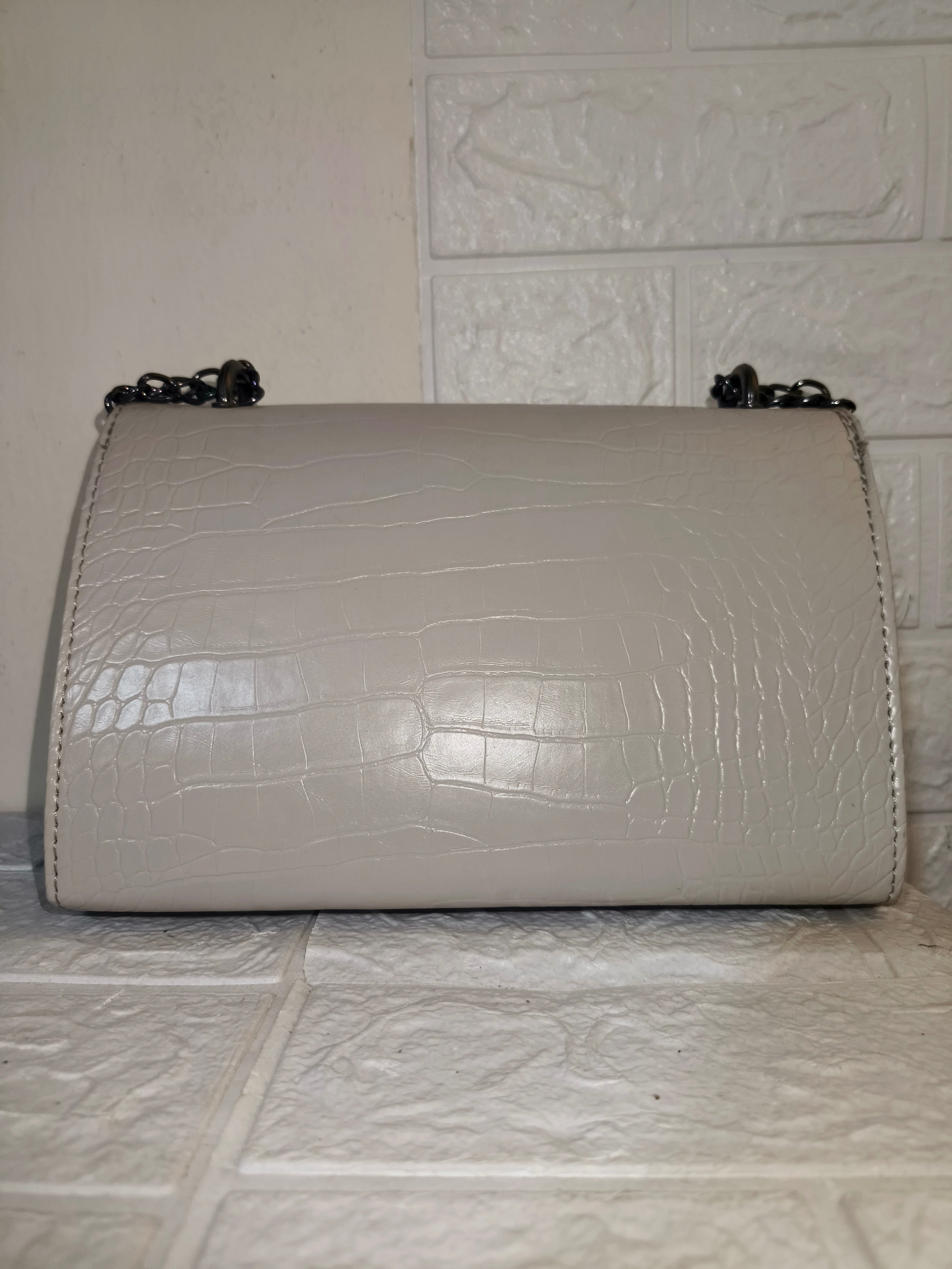 Marina Galanti small croc-embossed leather crossbody bag.