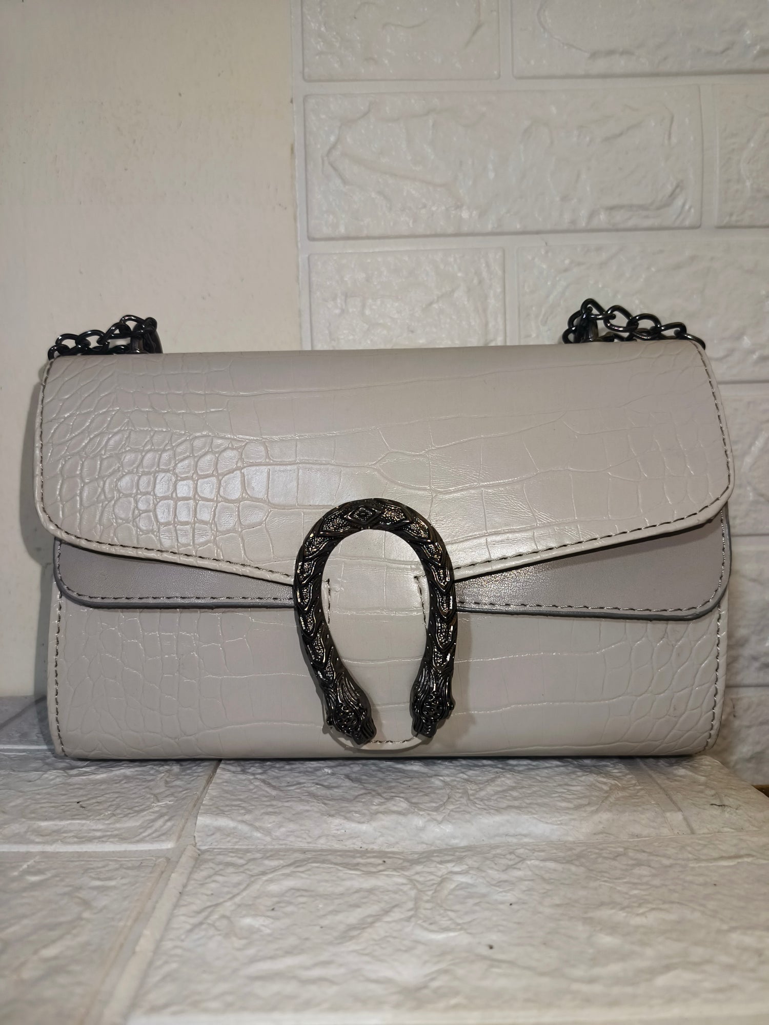 Marina Galanti small croc-embossed leather crossbody bag.