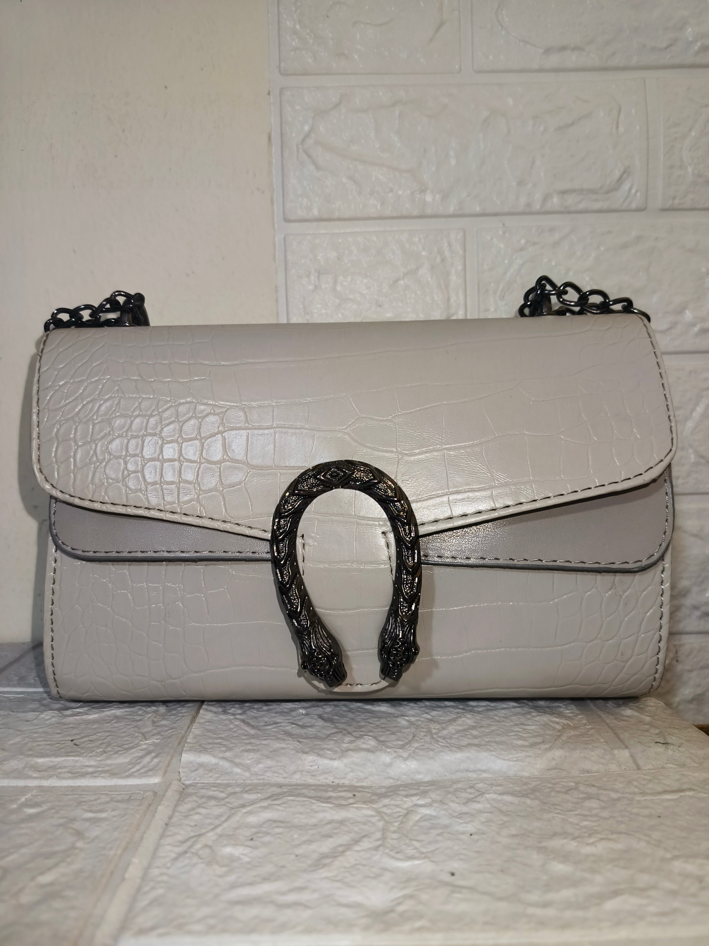 Marina Galanti small croc-embossed leather crossbody bag.