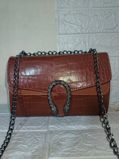 Marina Galanti small croc-embossed leather crossbody bag.